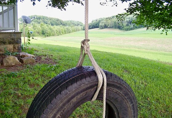 A tire swing in a yard is a beautiful thing, giving you a bird's eye view of the sky and, even better if it leads to a lake or river.