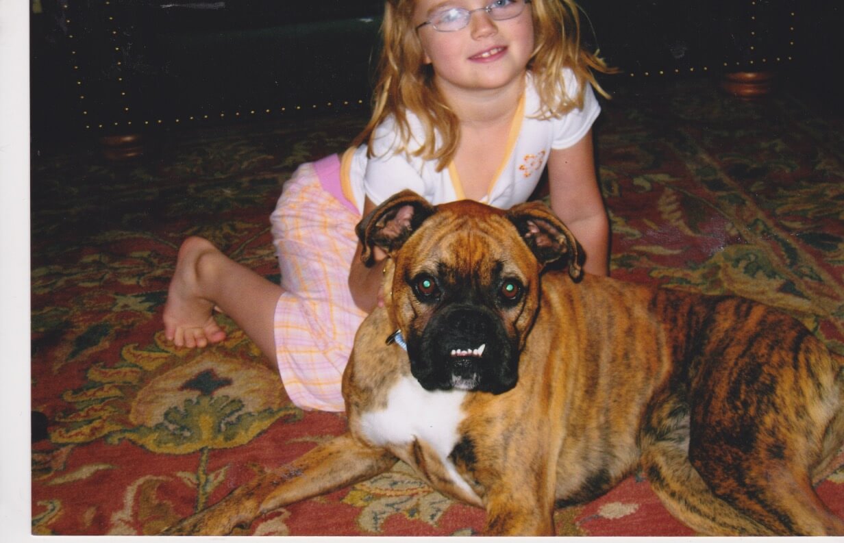 Our less-than-photogenic dog, Tango, with my daughter, Isabella, her 