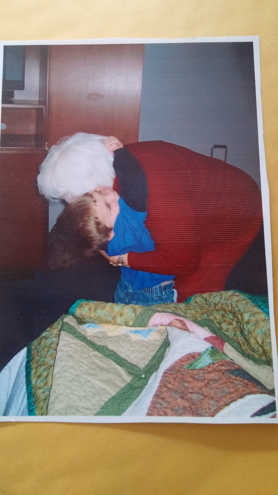 Grandma Rhetta gets a BIG hug from 5-year-old Mario for the beautiful quilt she made him.